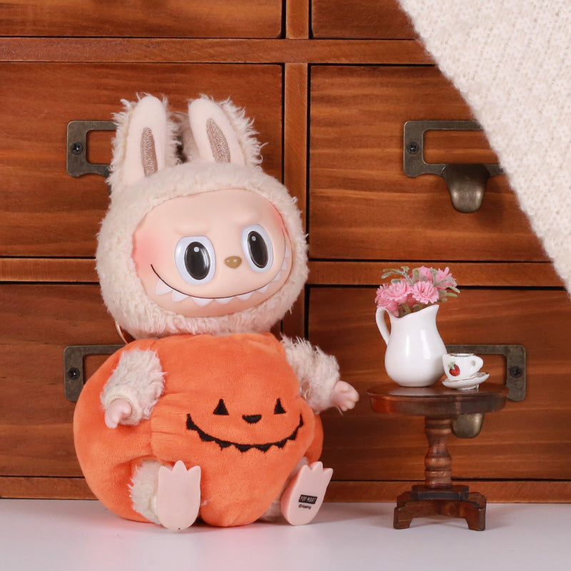 Labubu wearing a giant pumpkin body suit